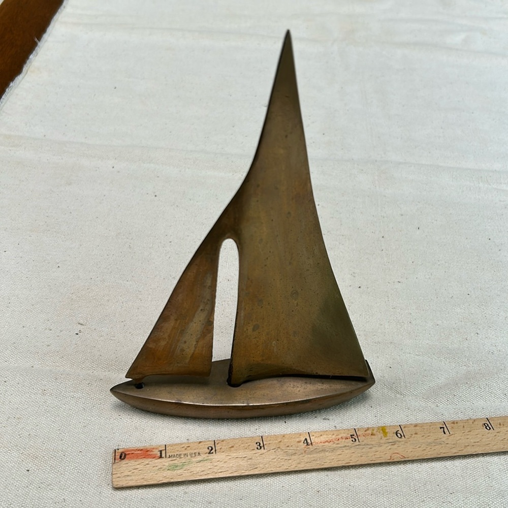Brass 8” tall sailboat, 2 separate casts, sail &  hull- joined at bottom. Heavy!